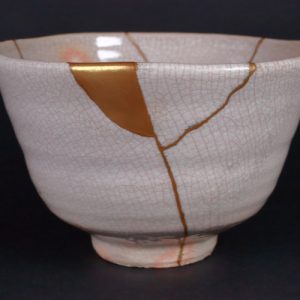 Kintsugi is a Japanese method of repairing porcelain pottery with gold it highlights the cracks instead of disguising them.